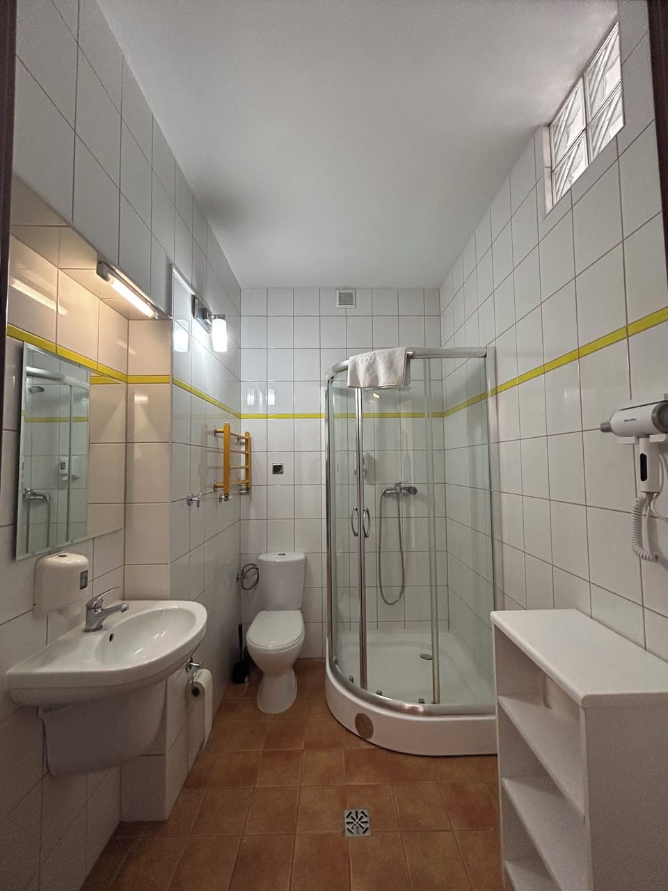 Shower, towels, toilet paper