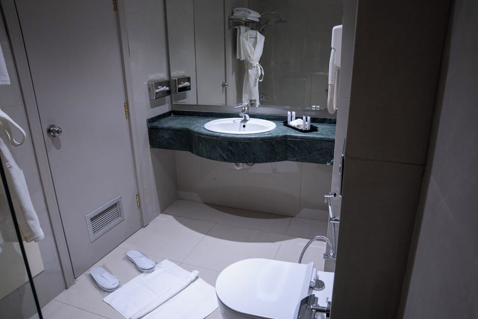 Comfort Twin Room, 1 Bedroom, City View | Bathroom | Shower, hair dryer, bathrobes, slippers