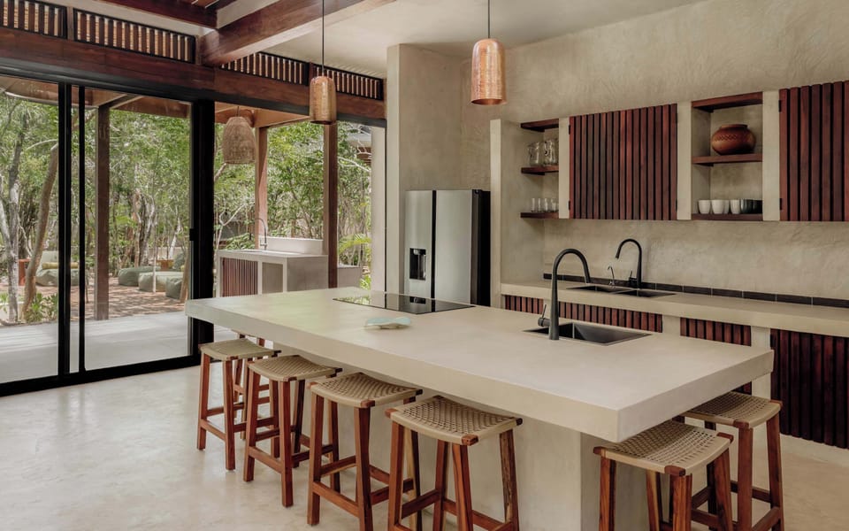 Full kitchen with a long breakfast bar and premium appliances.