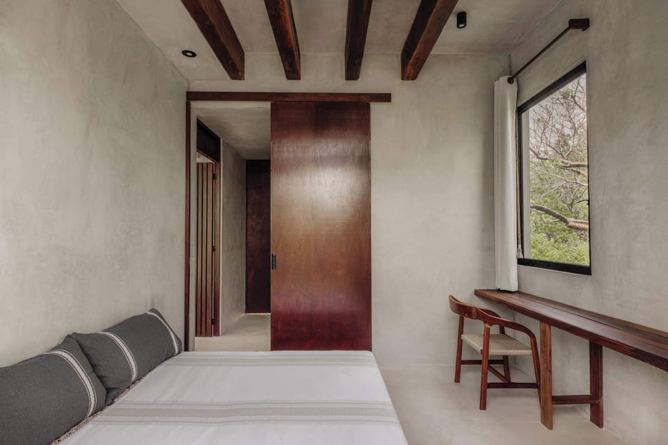 Bedroom 6 – Bright bedroom with private terrace access.