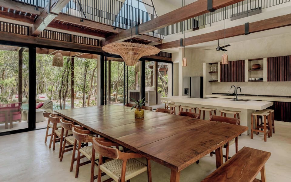Indoor dining area with a long wooden table.