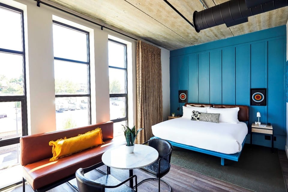 Relax in sun-drenched comfort with king bed and lounge area.