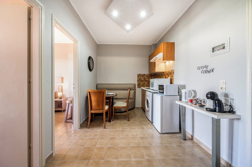 Family Quadruple Room, Balcony, City View | Private kitchen | Full-size fridge, microwave, stovetop, espresso maker