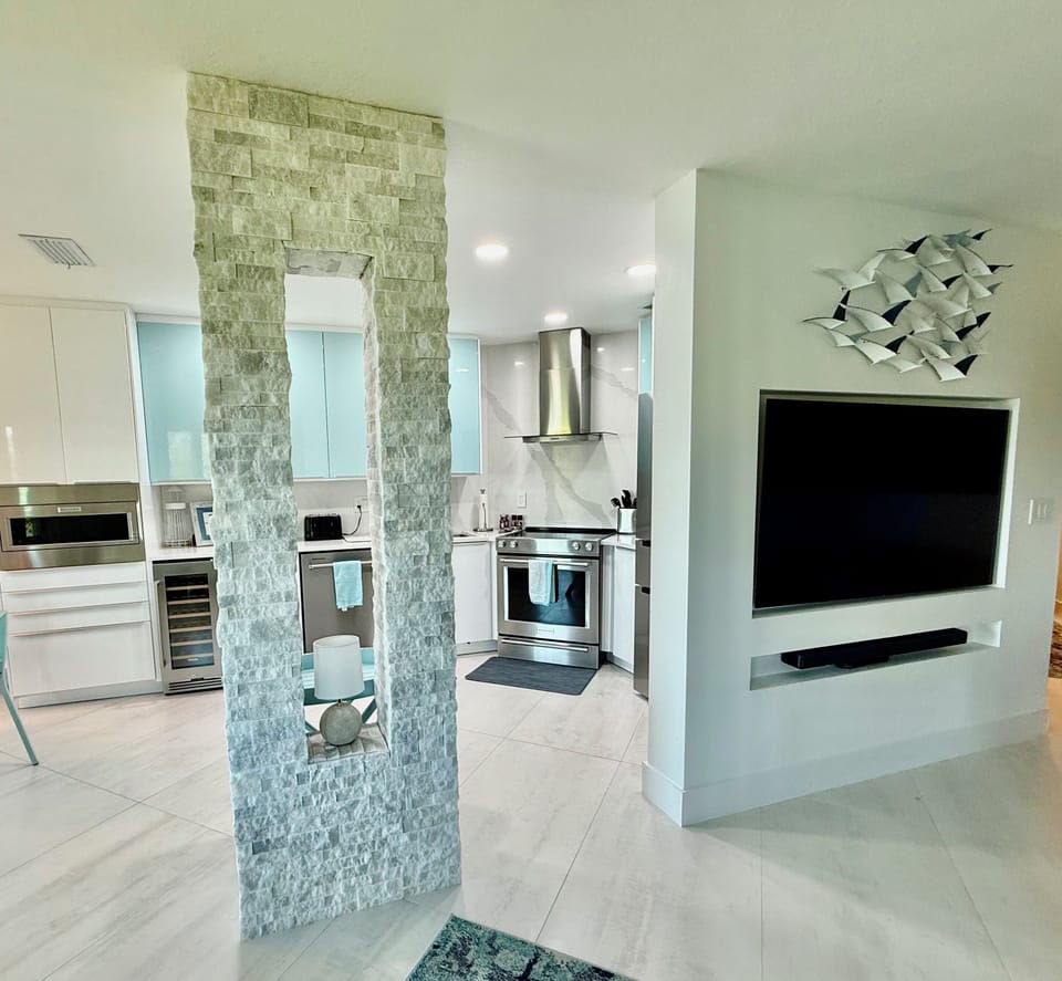 Open-concept living room, dining and kitchen