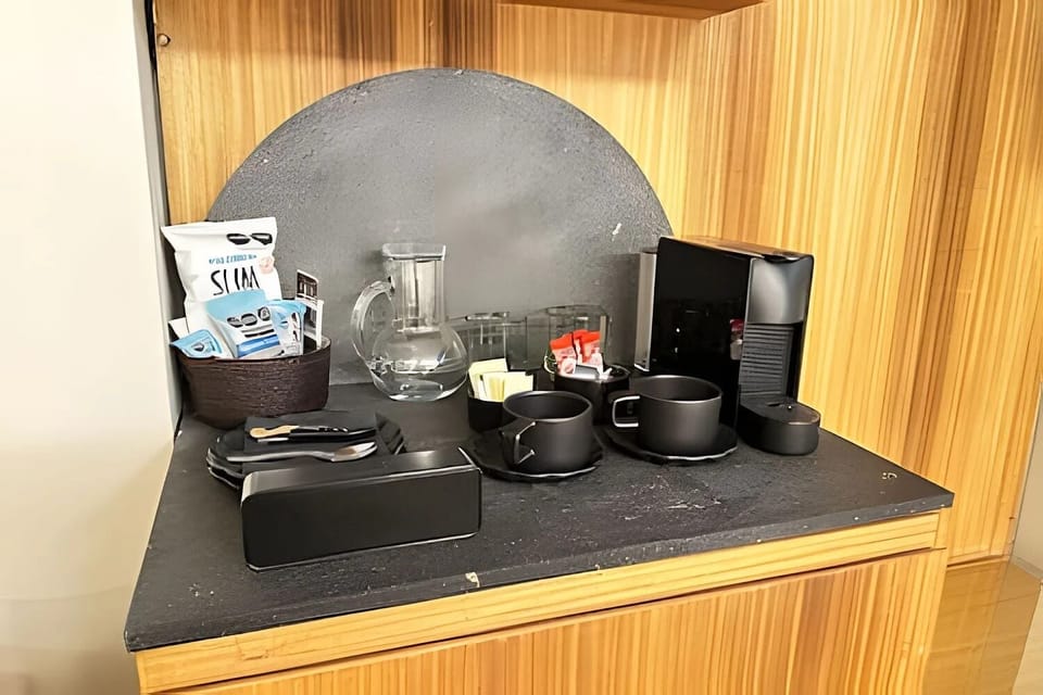 Suite | Private kitchen | Mini-fridge, microwave, espresso maker, eco-friendly cleaning products