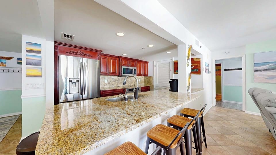 Large Bar with barstools!  So Much Counter space in this Condo!