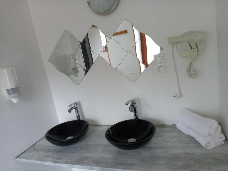 Family Quadruple Room, Hill View | Bathroom | Hair dryer, towels, soap, shampoo