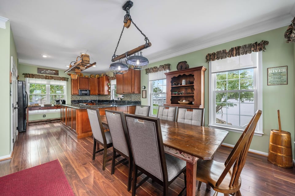Gather in dining room with plenty of seating and picturesque window river views