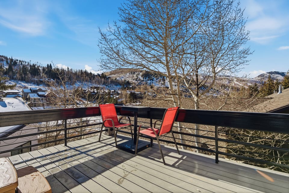 The deck provides comfortable seating with scenic mountain views, making it an ideal spot for morning coffee, sunset relaxation, or après-ski downtime.