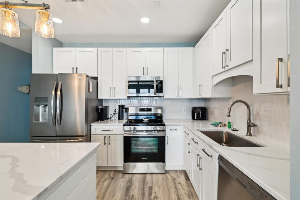 Full Kitchen 
Stainless steel refrigerator 
stove
microwave
dishwasher
Keurig & Regular coffee pot