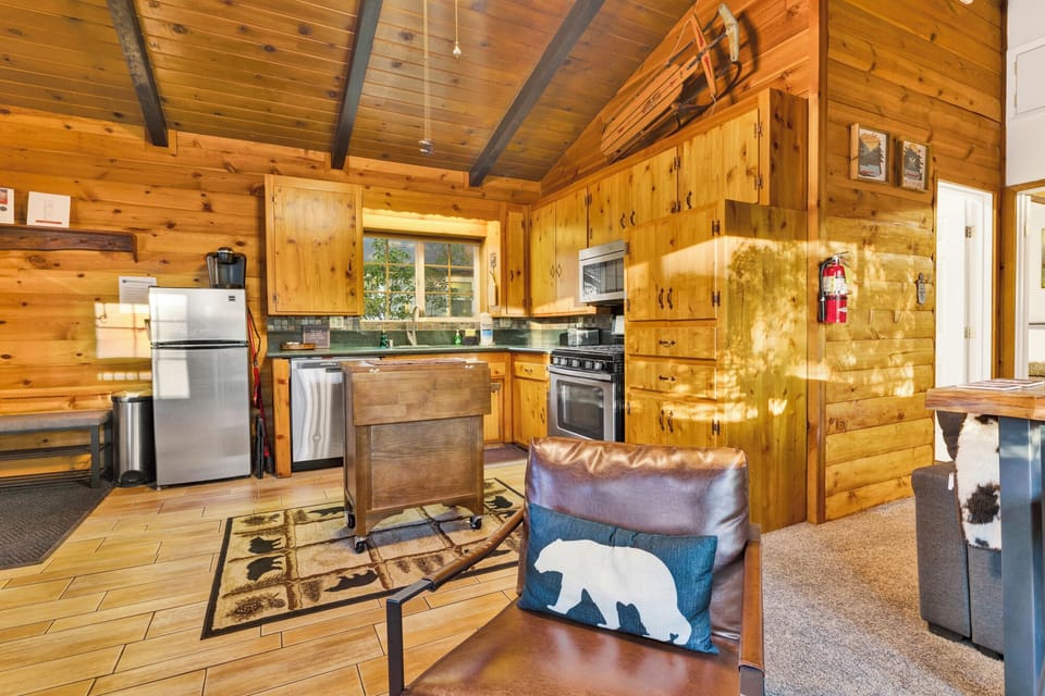 Fully equipped kitchen with stainless steel appliances, ample counter space, and warm wood cabinetry everything you need to cook like home.