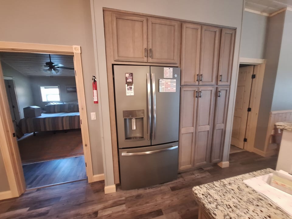 large fridge with ice and water in door