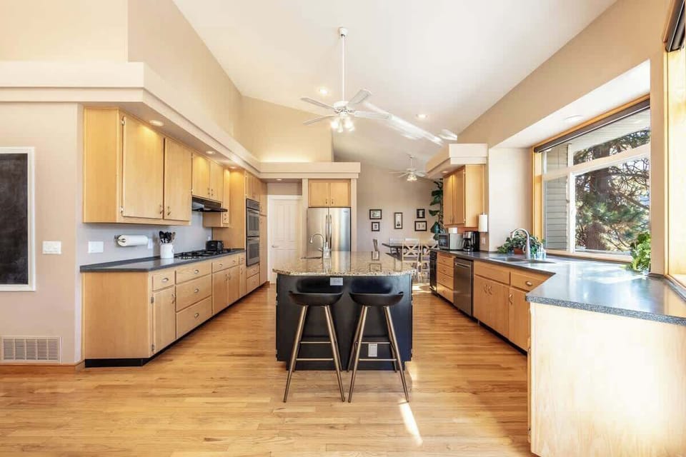 Large kitchen with bar stool seating to enjoy home cooked meals during your stay 