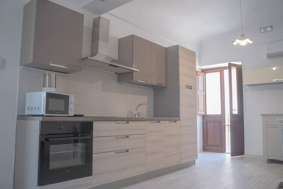 Comfort Apartment | Private kitchen | Fridge, stovetop, espresso maker, cookware/dishes/utensils