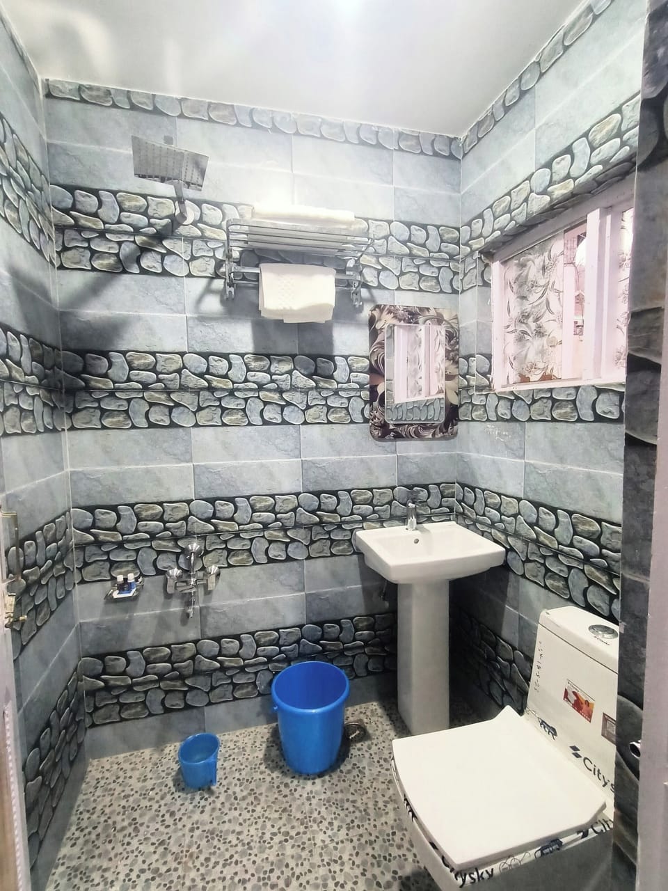 Shower, slippers, towels, soap