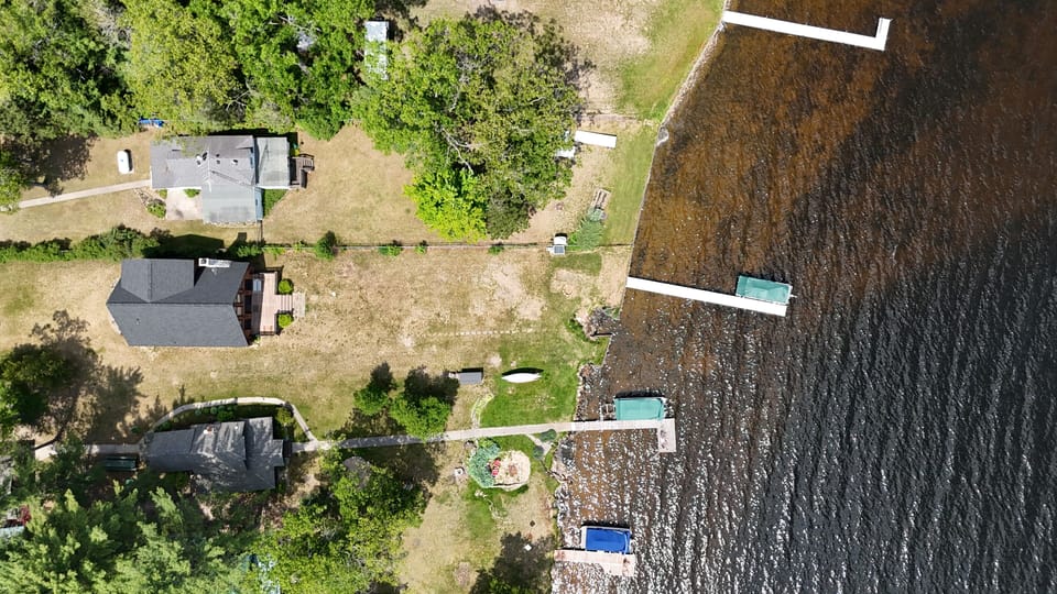 EXTERIOR:  Top-down view of the property to Van Etten Lake