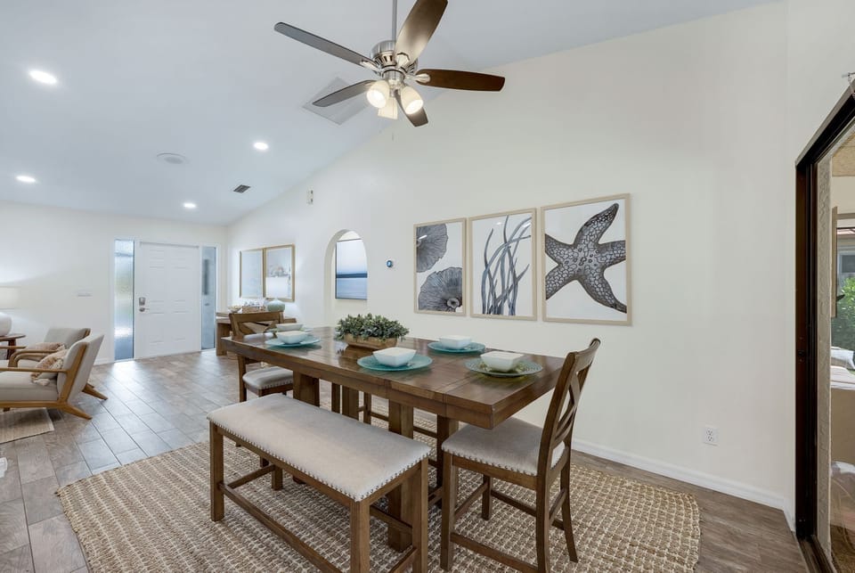 Coastal-inspired dining area with seating for six — perfect for enjoying meals and making memories together.