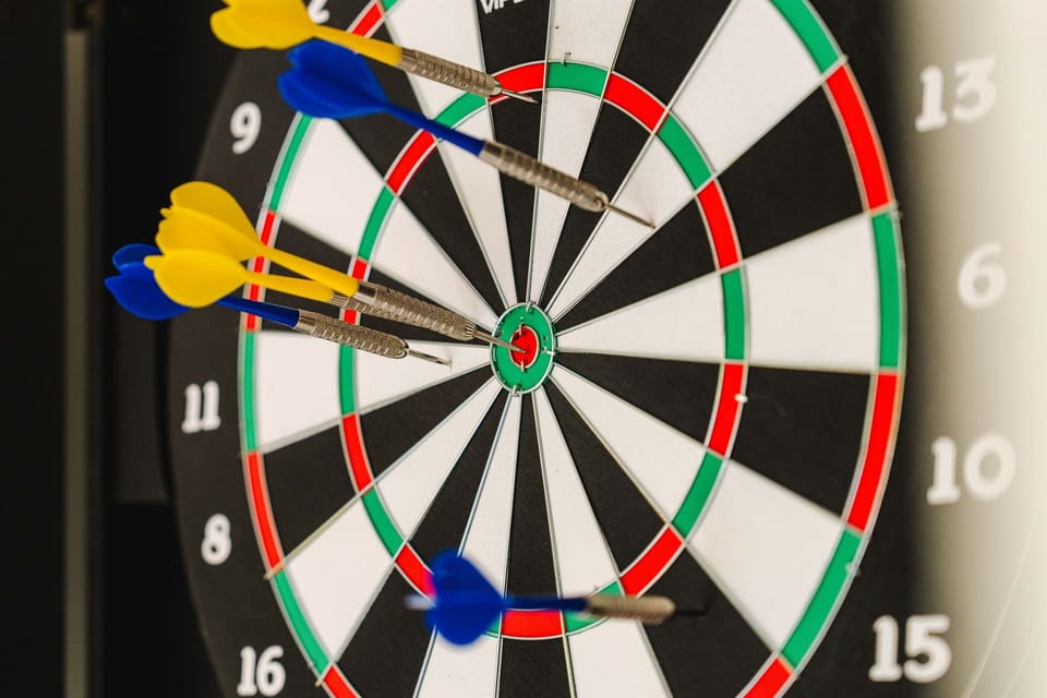 Sharpen your aim with a classic dartboard in the game room.