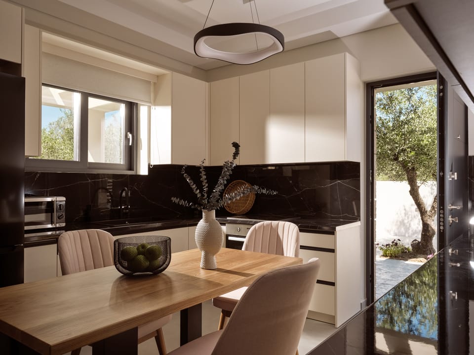 Sleek design and quality appliances elevate every moment in the villa’s kitchen.