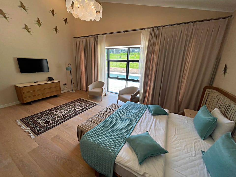 Four-Bedroom Villa | Minibar, in-room safe, iron/ironing board (on request), WiFi (free)