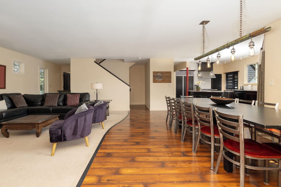 Gather around the spacious dining table for memorable meals, then unwind in your comfortable living room with warm lighting.
