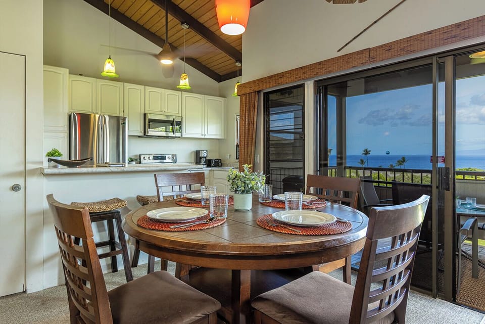 Spacious dining area with seating for six, seamlessly connected to the fully equipped kitchen. (4 at the kitchen table and 2 at the kitchen )