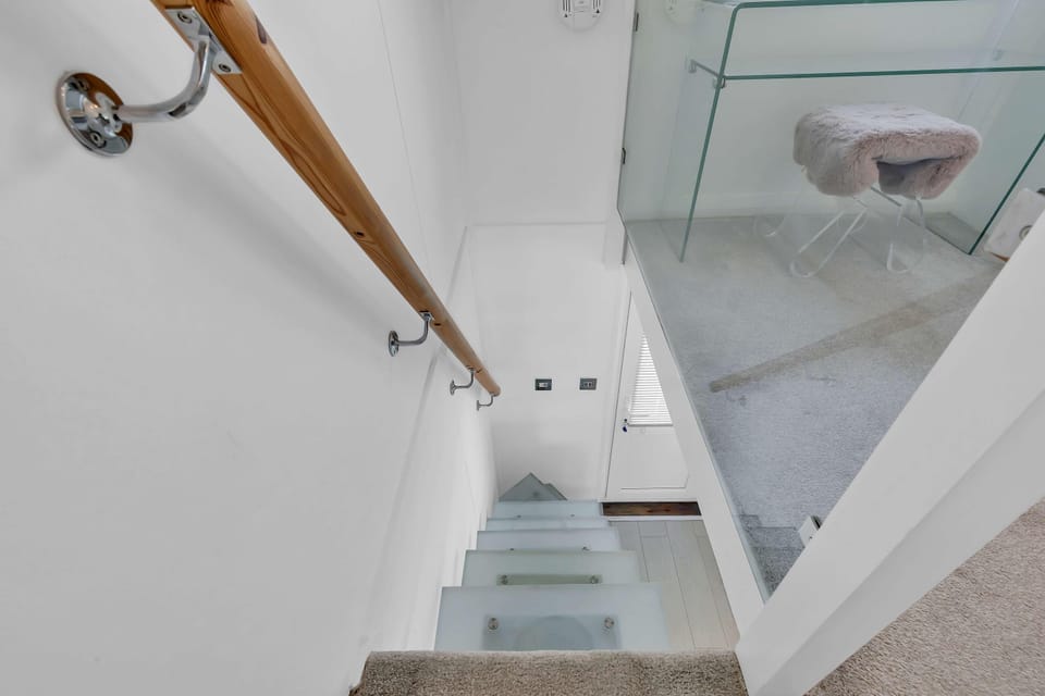 Glass Stairs leading down stairs 