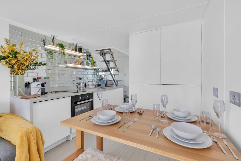 Small dining table for two next to kitchen and window