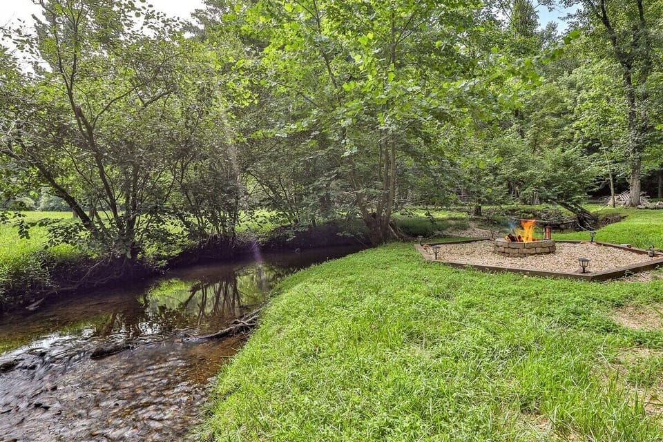 Enjoy Hanging Out By The Creek With A Fire