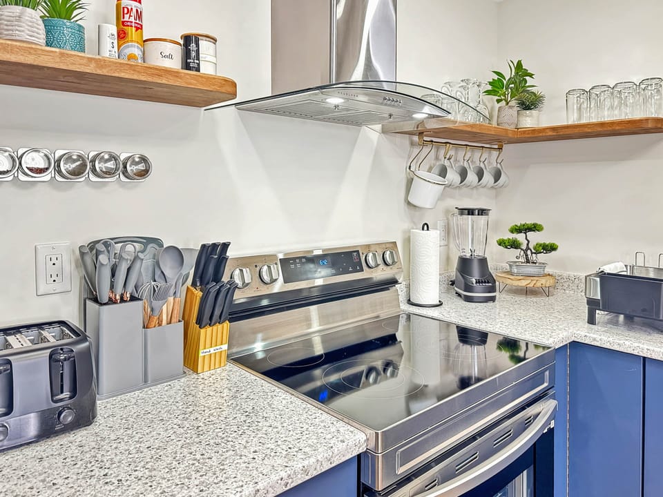 Modern Kitchen with Stainless-Steel Stove and Organized Countertop