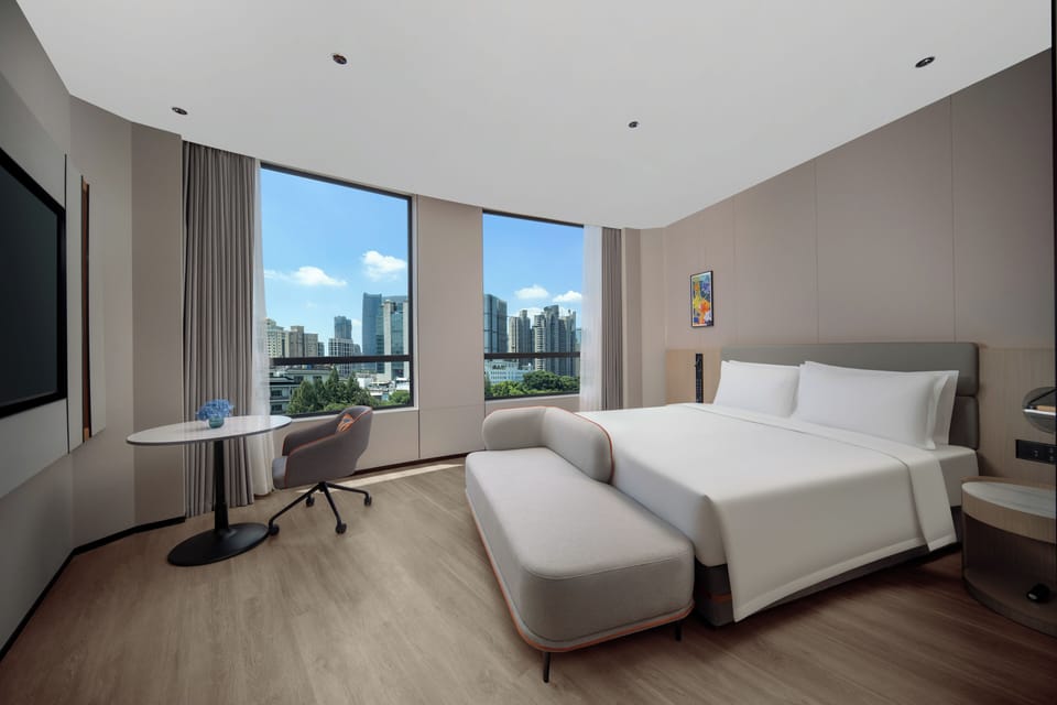 1 King Standard City View | Premium bedding, down comforters, laptop workspace, blackout drapes