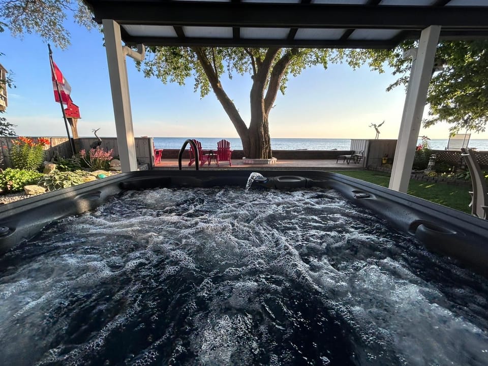Unwind in the hot tub with Lake Erie as your backdrop.