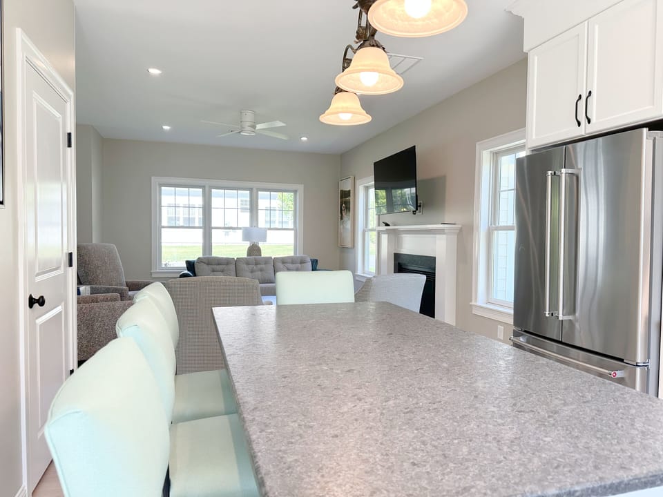 Kitchen island with seating overlooking Living Rm