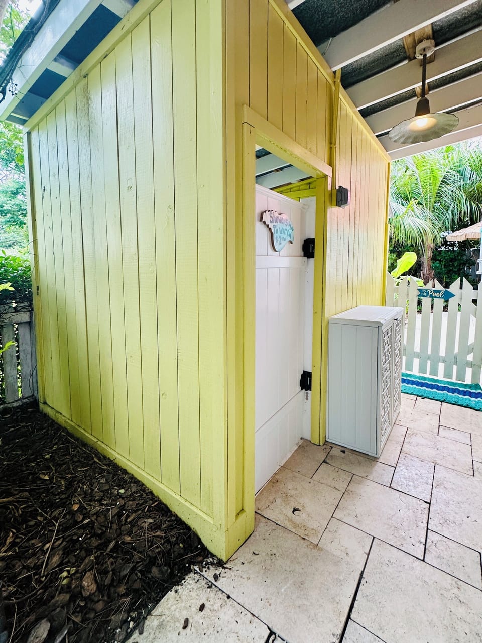 A Short Stroll to the Fully Enclosed Bathroom with Ceiling Fan.  