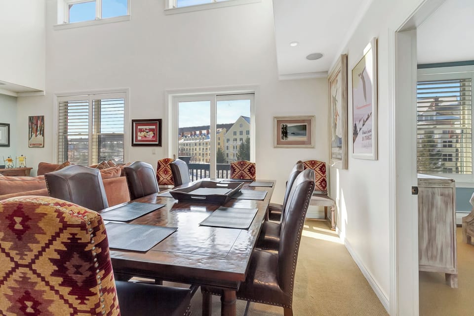 - Dining space with natural light and resort views   - Mountain-style decor and plush seating for eight   - Perfect for shared meals after a day on the slopes