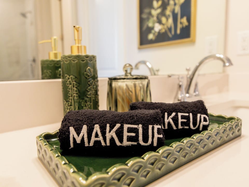 Dual-sink vanity with ample counter space and bold mirrors