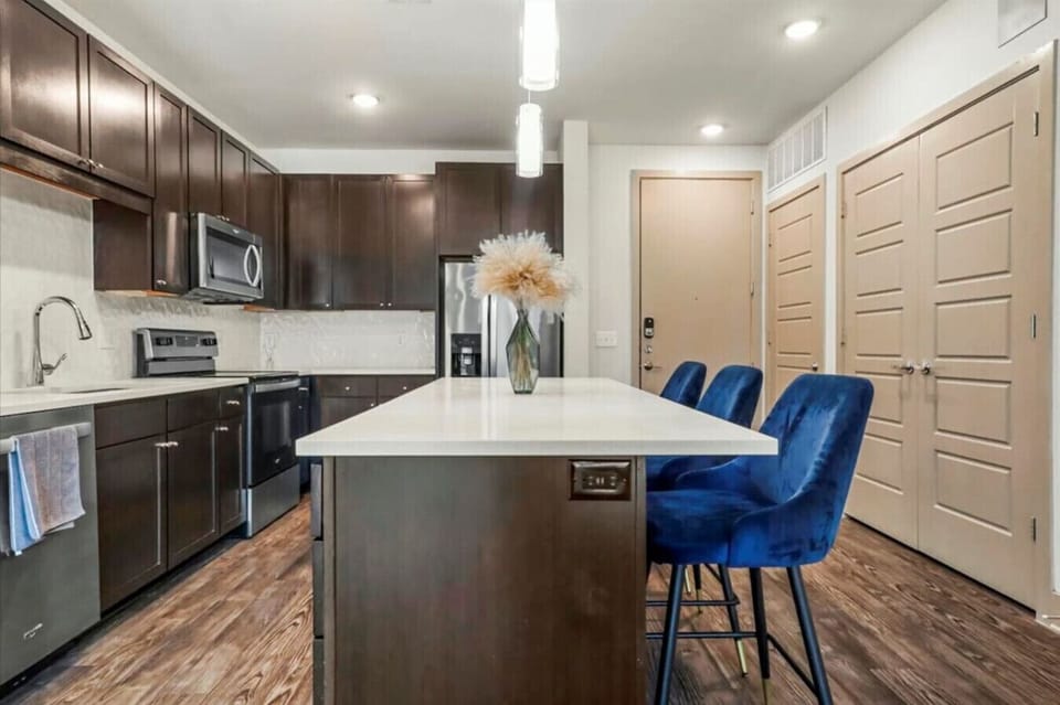 Enjoy morning coffee or evening meals around the spacious kitchen island.`