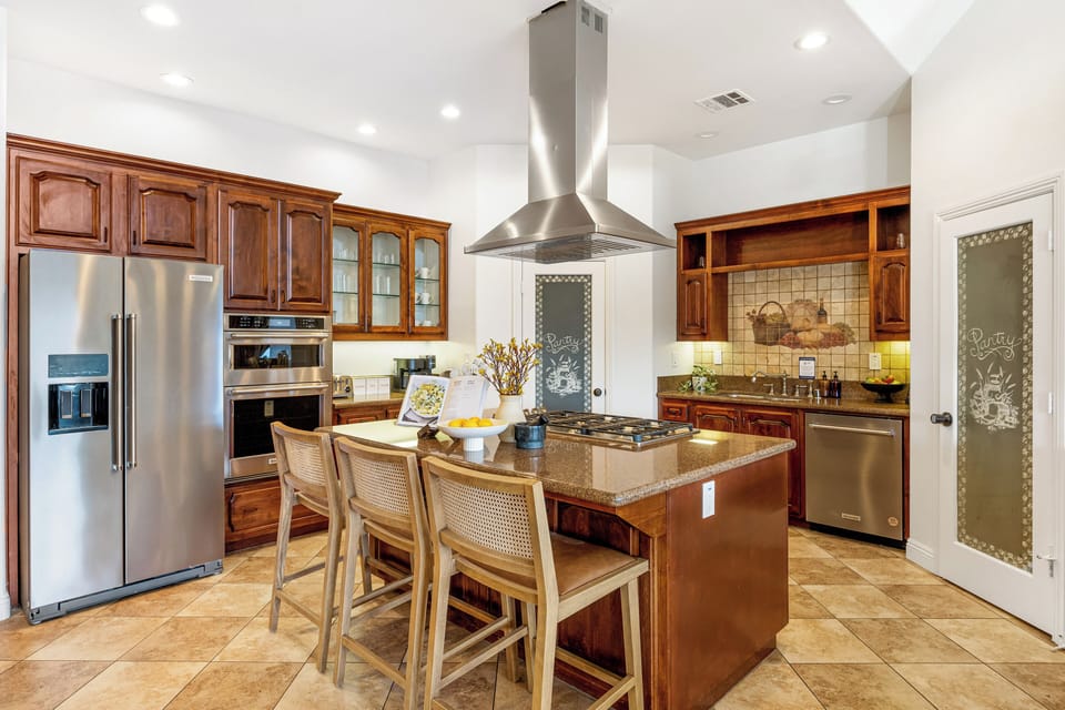 Modern and sleek kitchen with barstool seating.