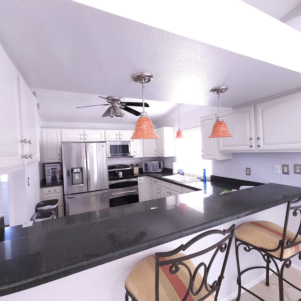 Open kitchen, with elevated seating.