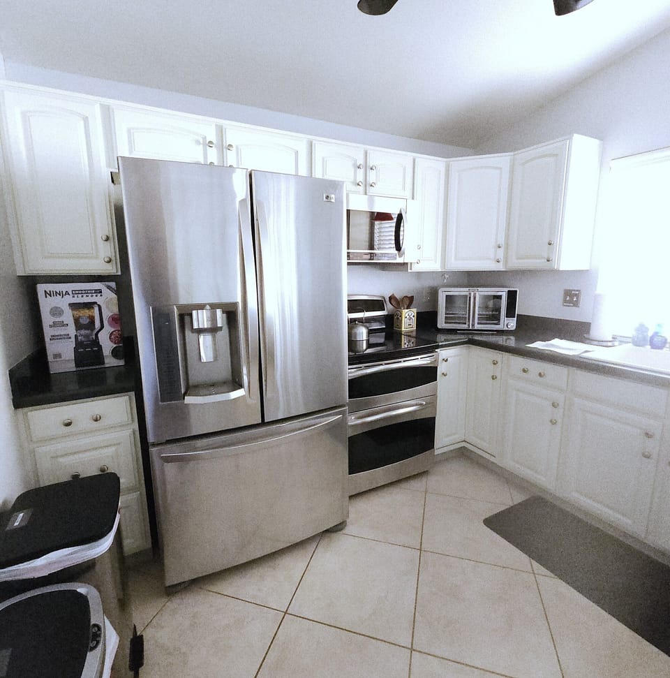 Kitchen, complete with AirFryer, blender, double oven, microwave and dishwasher.