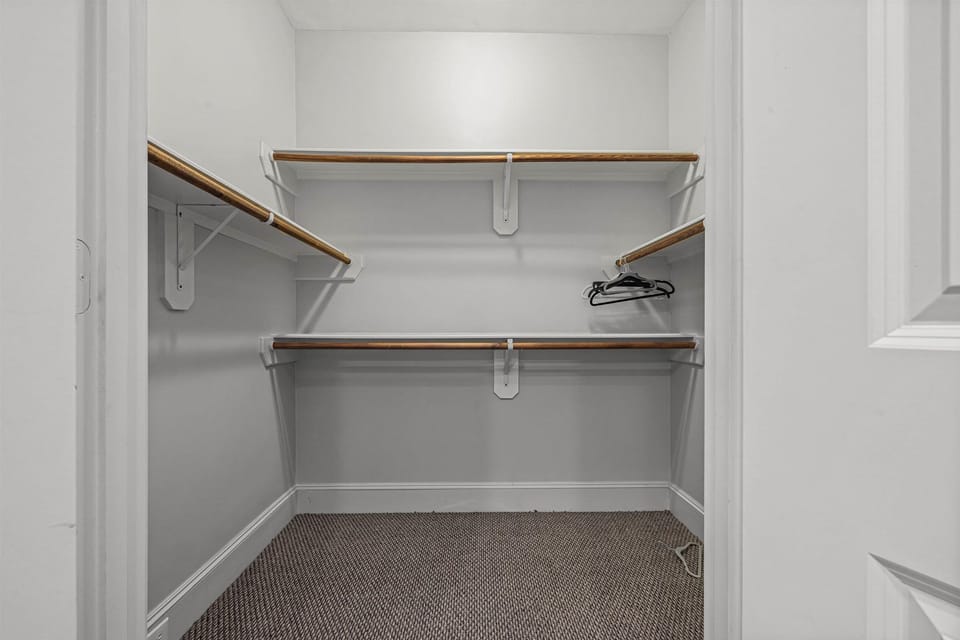 Fully equipped 2nd walk-in primary closet.