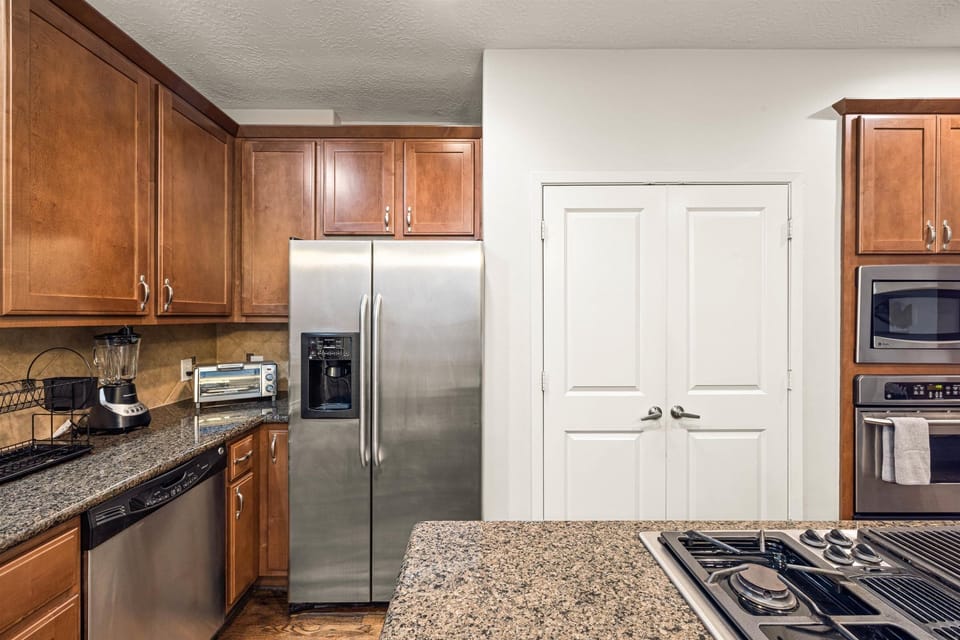 Fridge does NOT dispenses water or ice. Stainless steel appliances. 