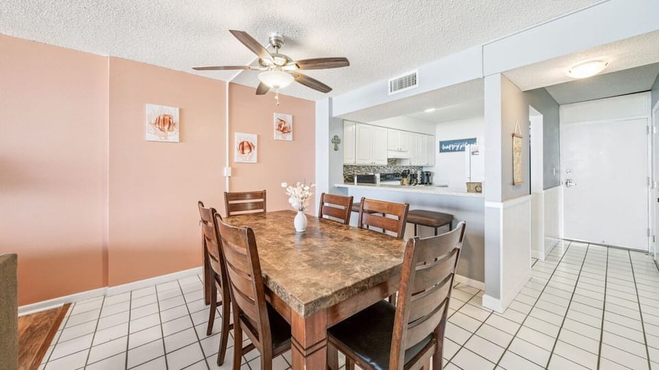 Spacious dining area with seating for six—ideal for family meals or game nights near the kitchen.