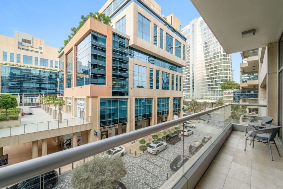 Balcony Retreat: Enjoy vibrant city views from your stylish, sunlit balcony oasis!