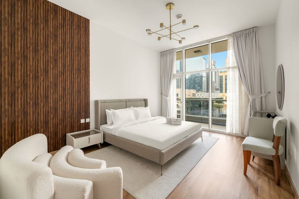 Urban Retreat: Sunlit haven with sleek design, stunning city views, and plush seating for relaxation!