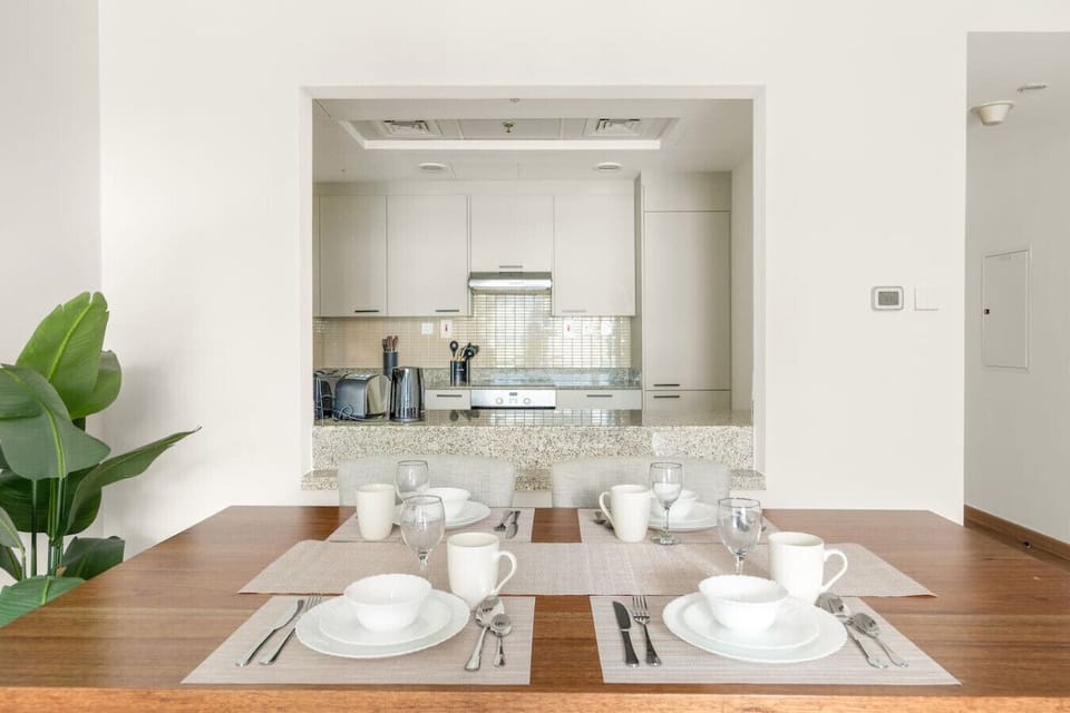 Dining Room: Stylish table set for memorable meals with a sleek kitchen view!