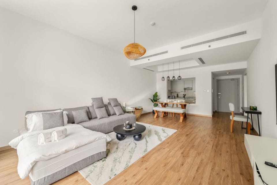 Living Room: Sunlit elegance with modern decor, plush seating, and a stylish dining nook!