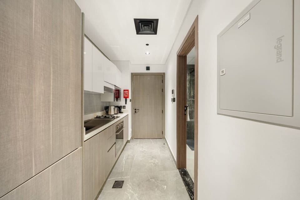 Kitchen: Modern design with sleek cabinetry and elegant marble floors for your culinary adventures!