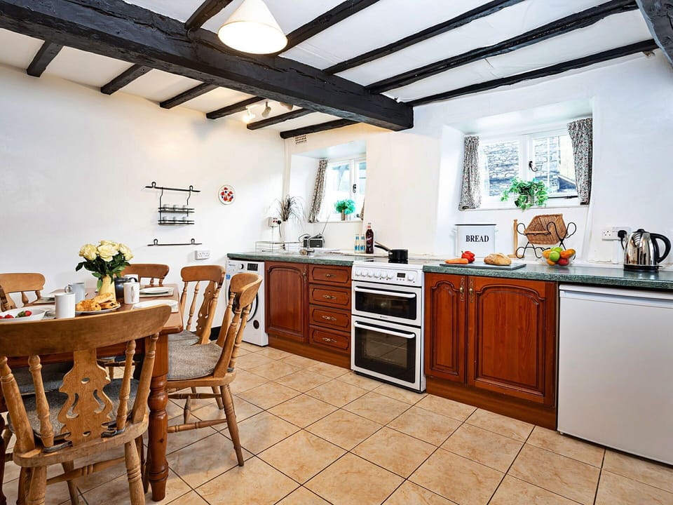 Furniture, Kitchen, Interior Design, Flooring, Countertop, Cabinetry, Wood, Kitchen Appliance, Floor, Room