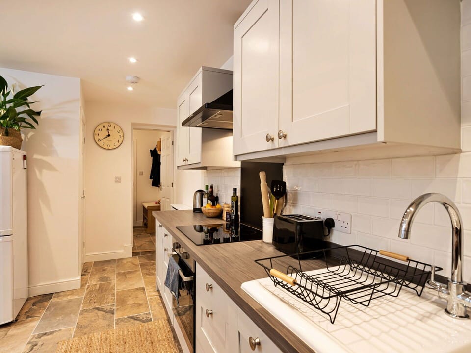 Kitchen Appliance, Countertop, Kitchen, Furniture, Cabinetry, Interior Design, Major Appliance, Flooring, Home Appliance, Wood
